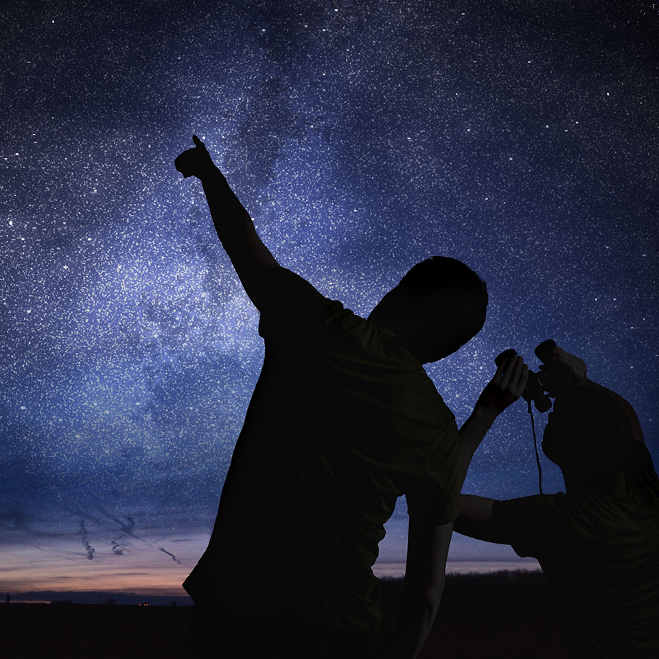 Two people stargazing.