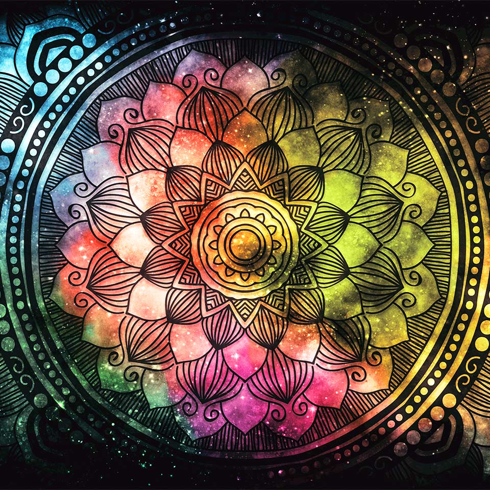 A mandala on a colourful galaxy background