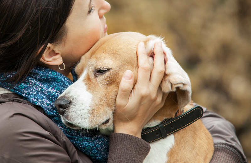 woman hugging dog
