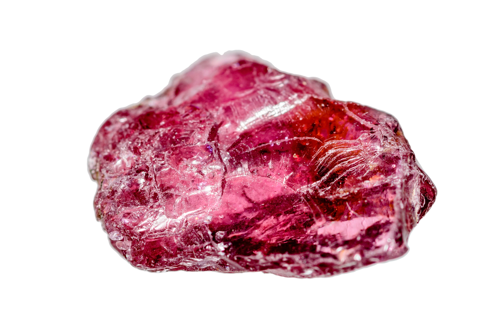 A piece of Rhodolite Garnet on a white background