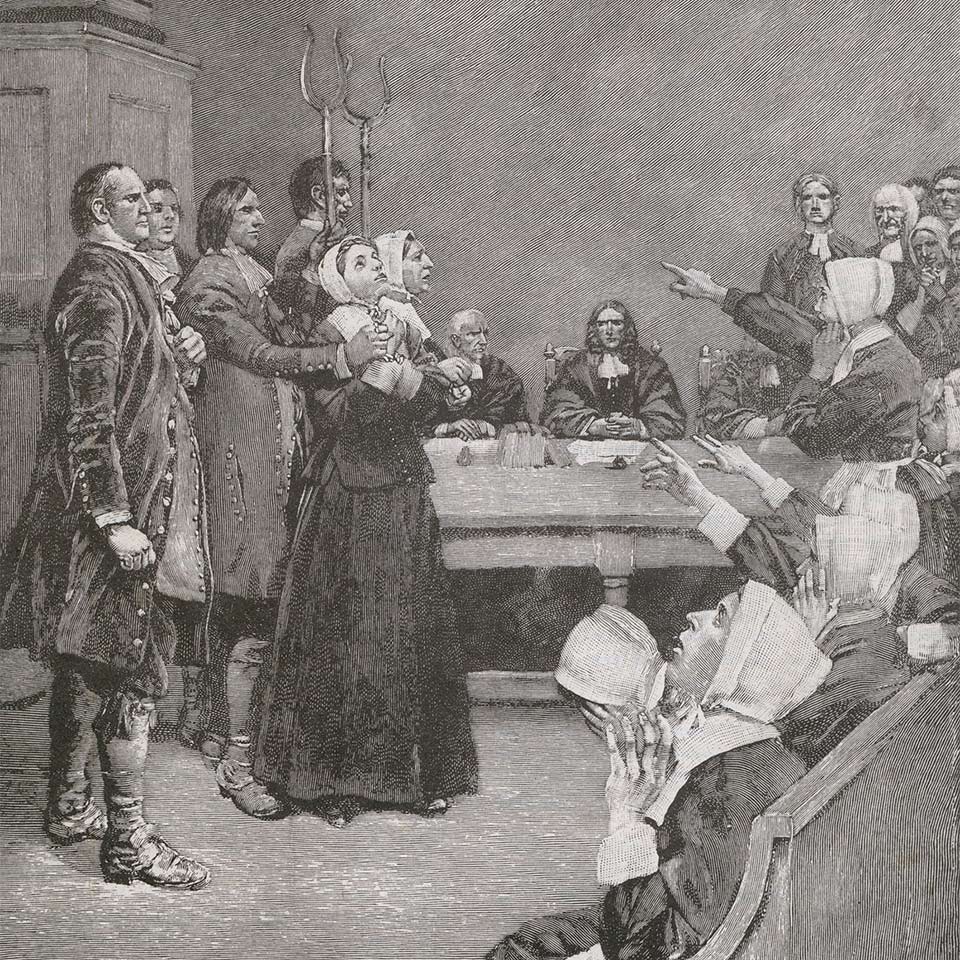 Two women standing trial as part of the Salem Witch Trials