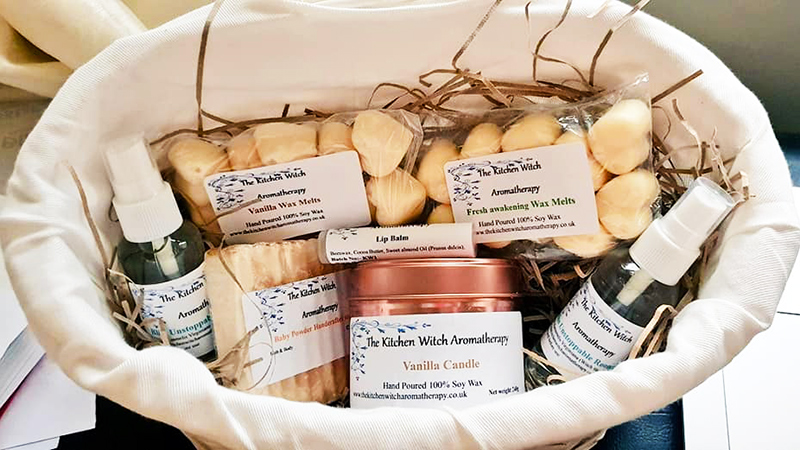 Basket of handmade soaps, candles and oils