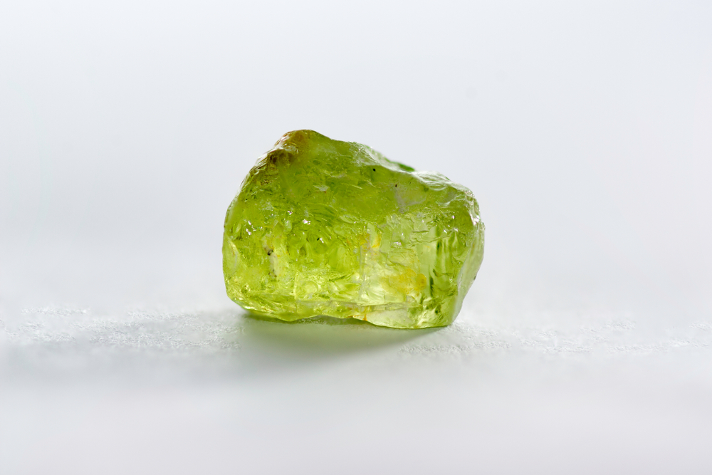 A piece of Peridot on a white background