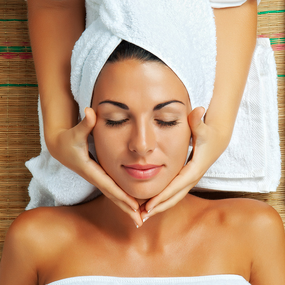 Portrait of a young beautiful woman receiving a spa treatment