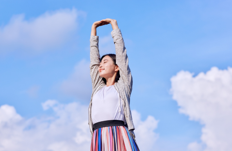 Image of someone stretching outdoors.