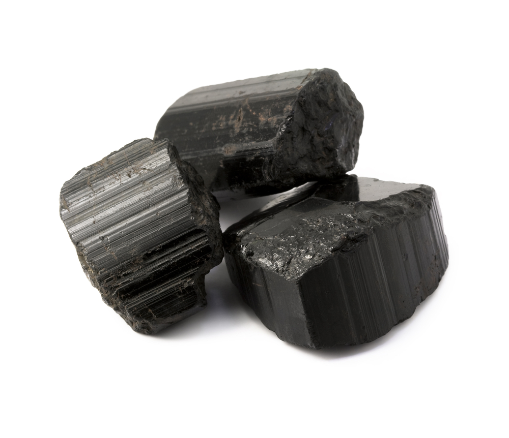 Three pieces of Black Tourmaline on a white background