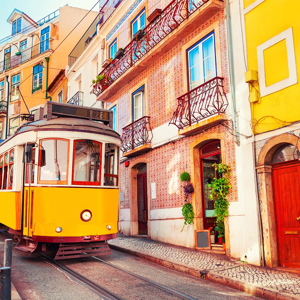 Yellow vintage tram on a street in Lisbon, Portugal