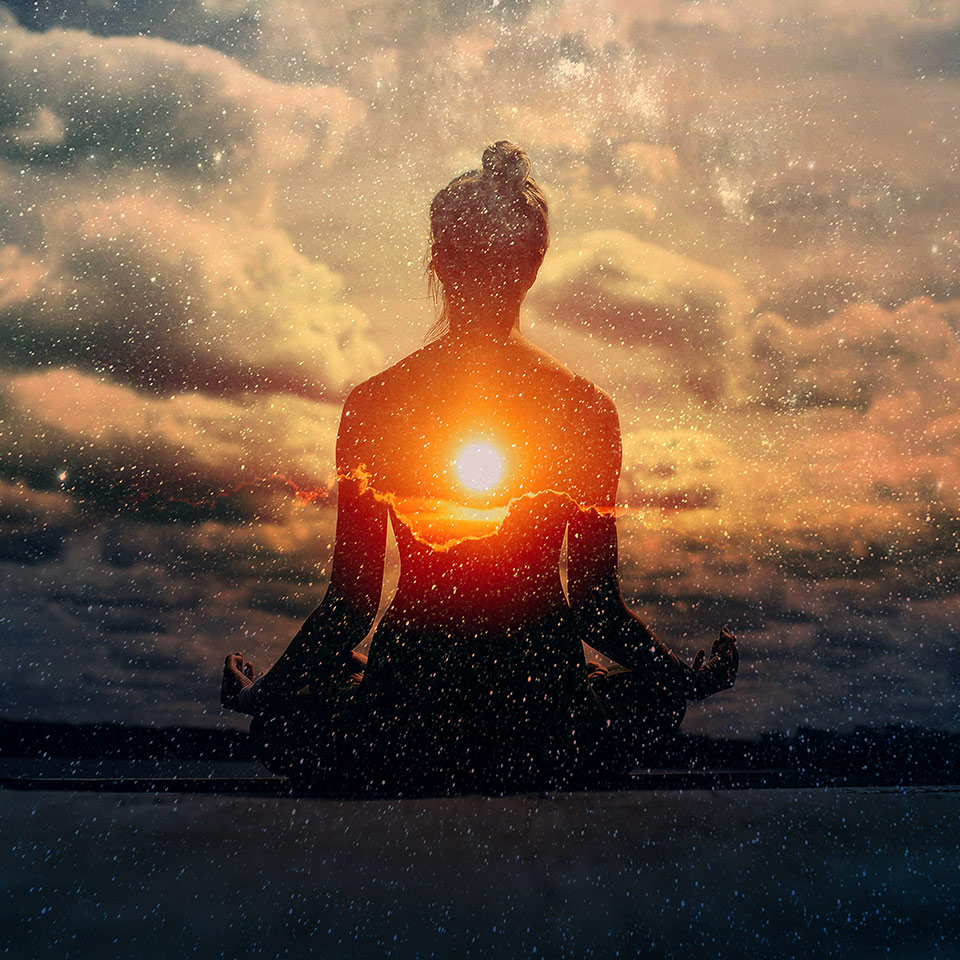 Multiple-exposure image of a woman practising pranayama breathwork outdoors.