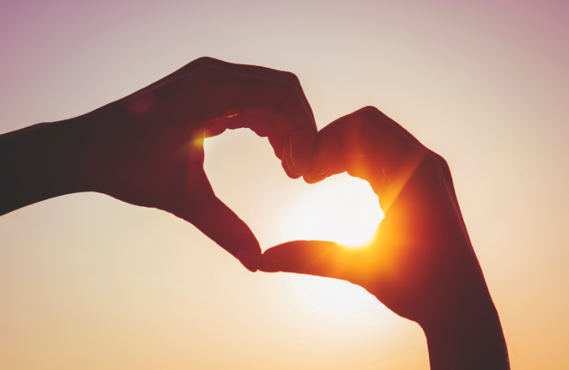 two hands making heart shape