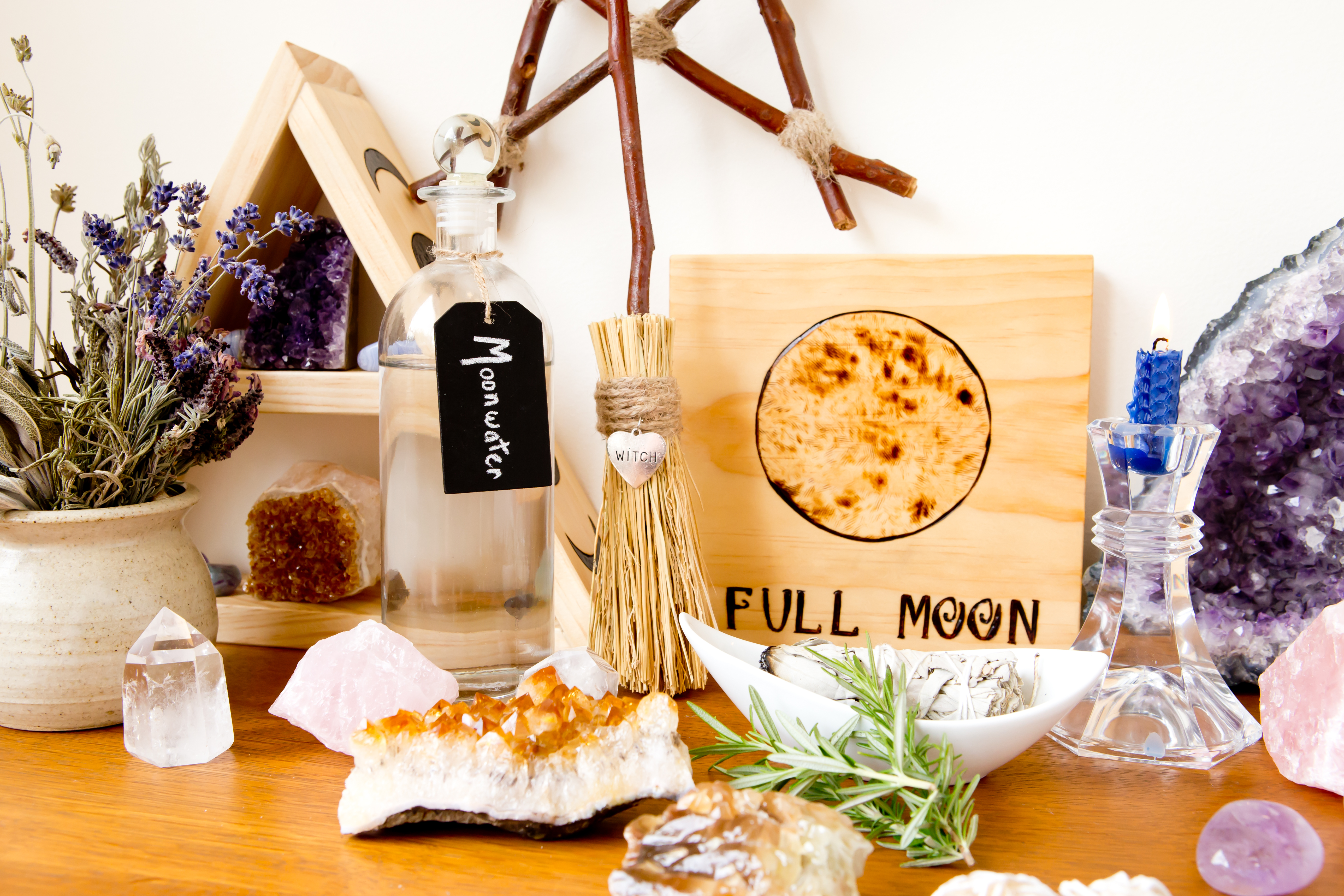 A number of items for a full moon ritual including crystals, moonwater and lavendar