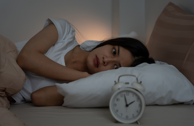 Woman struggling to sleep