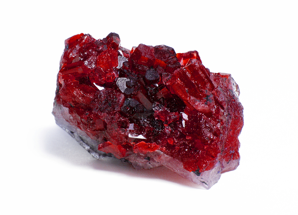A raw piece of Ruby on a white background
