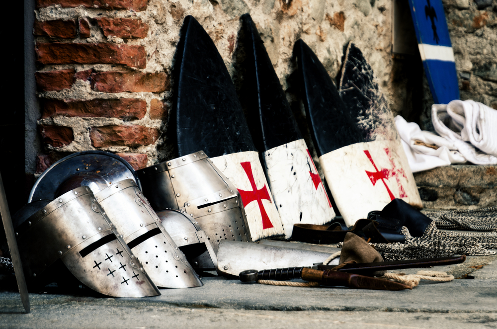Shields with the Templar emblem on and pieces of armour