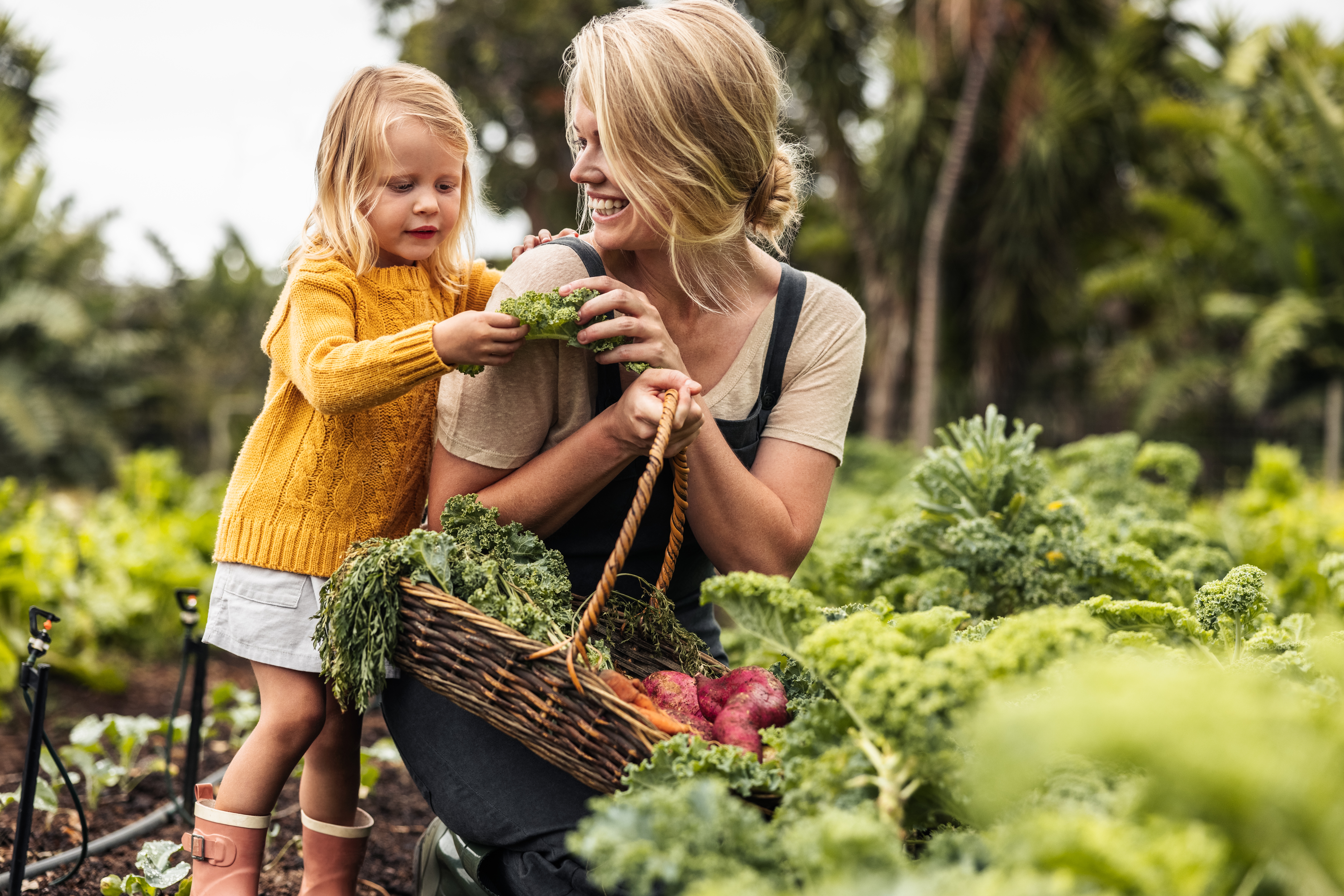 sweet image of mum and daughter gardening together