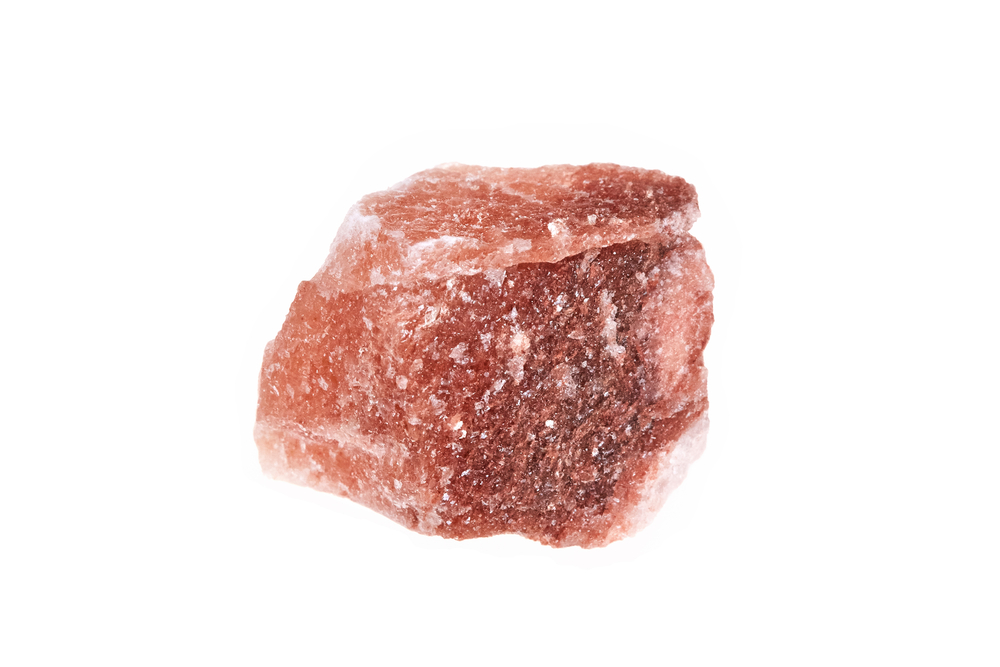 A piece of Pink Halite on a white background