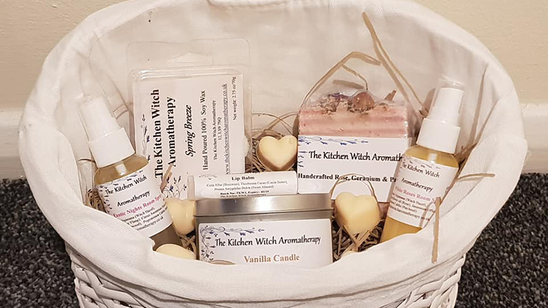 Basket of handmade soaps, candles and oils