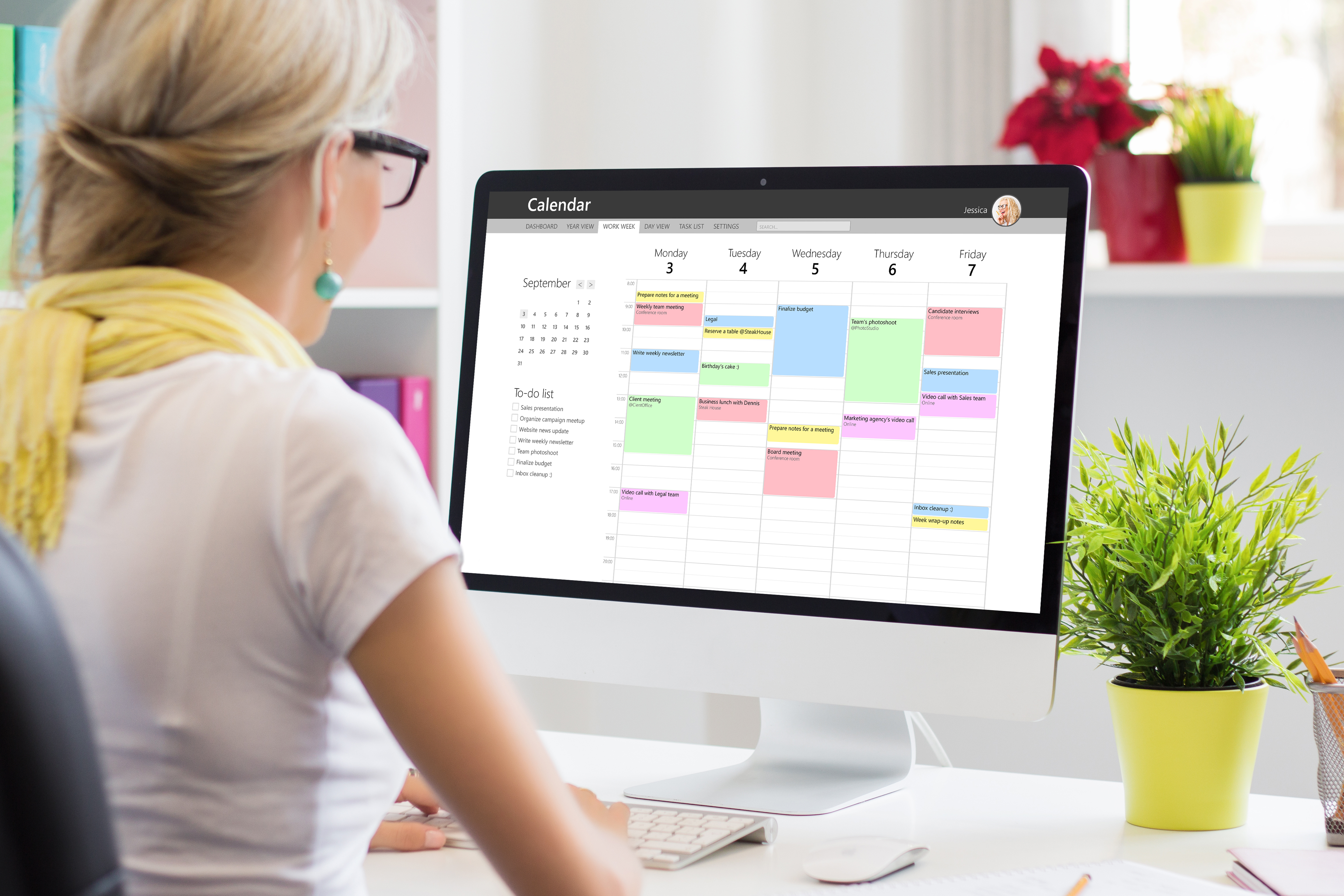 Woman doing time management on mac computer