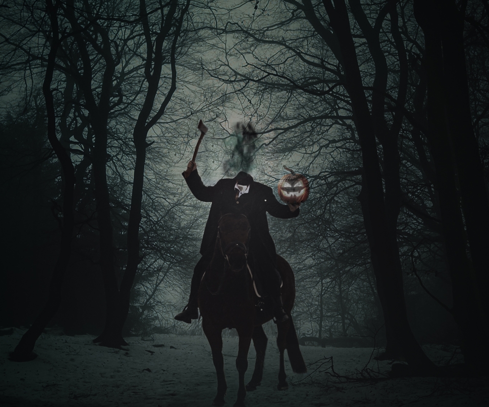 A man on a black horse holding his head