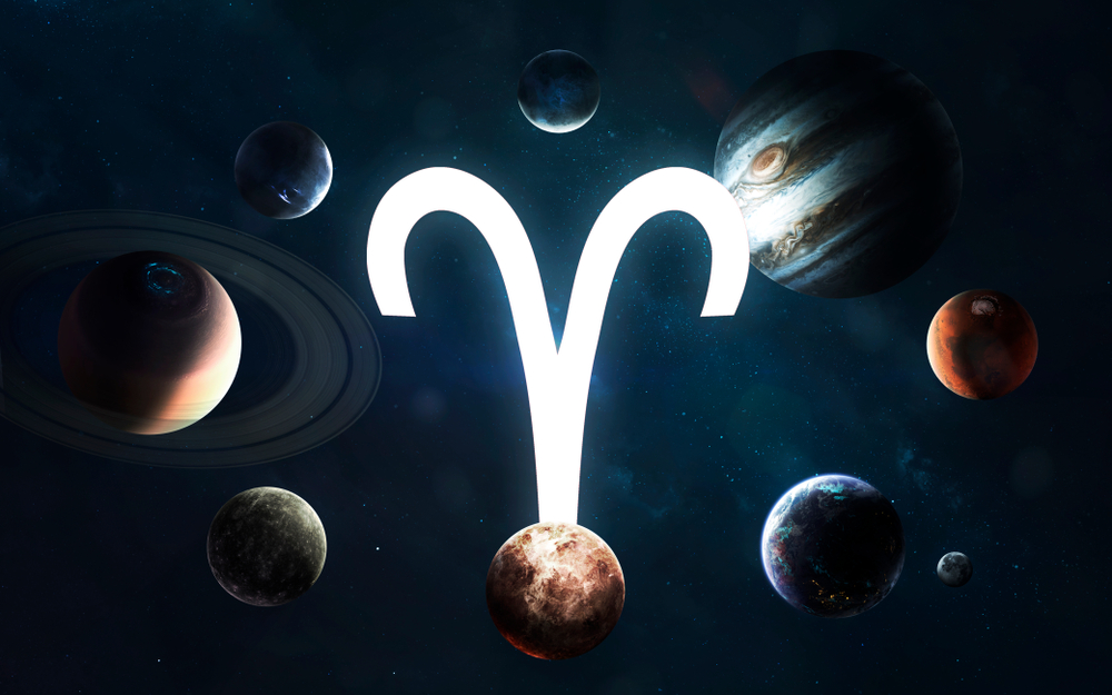 Aries star sign symbol surrounded by planets