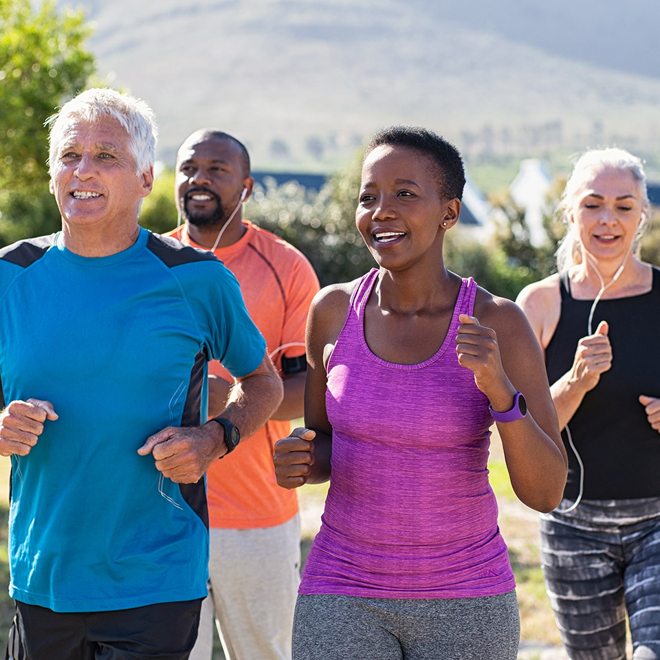 Group of people jogging in a park