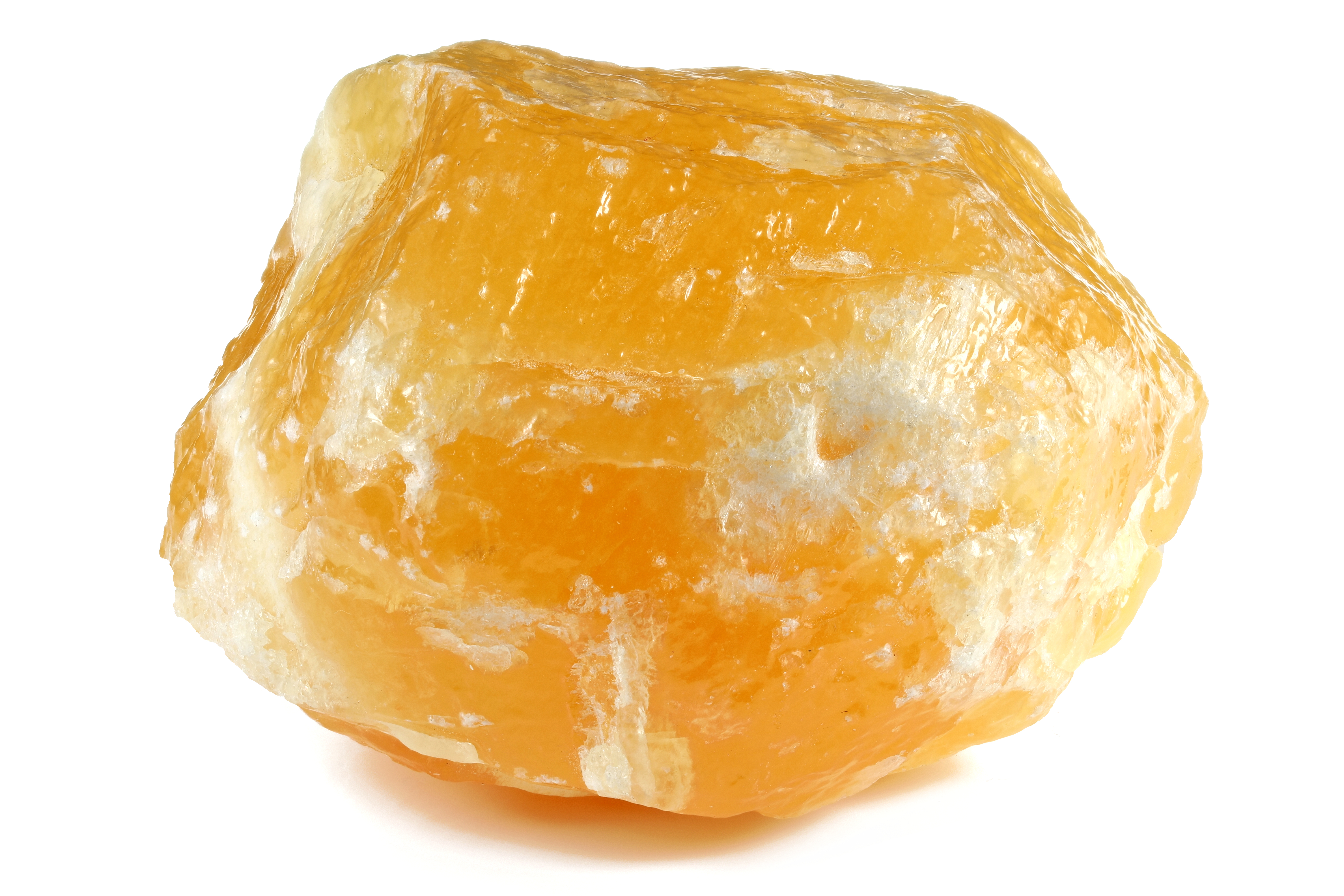 A piece of Orange Calcite on a white background