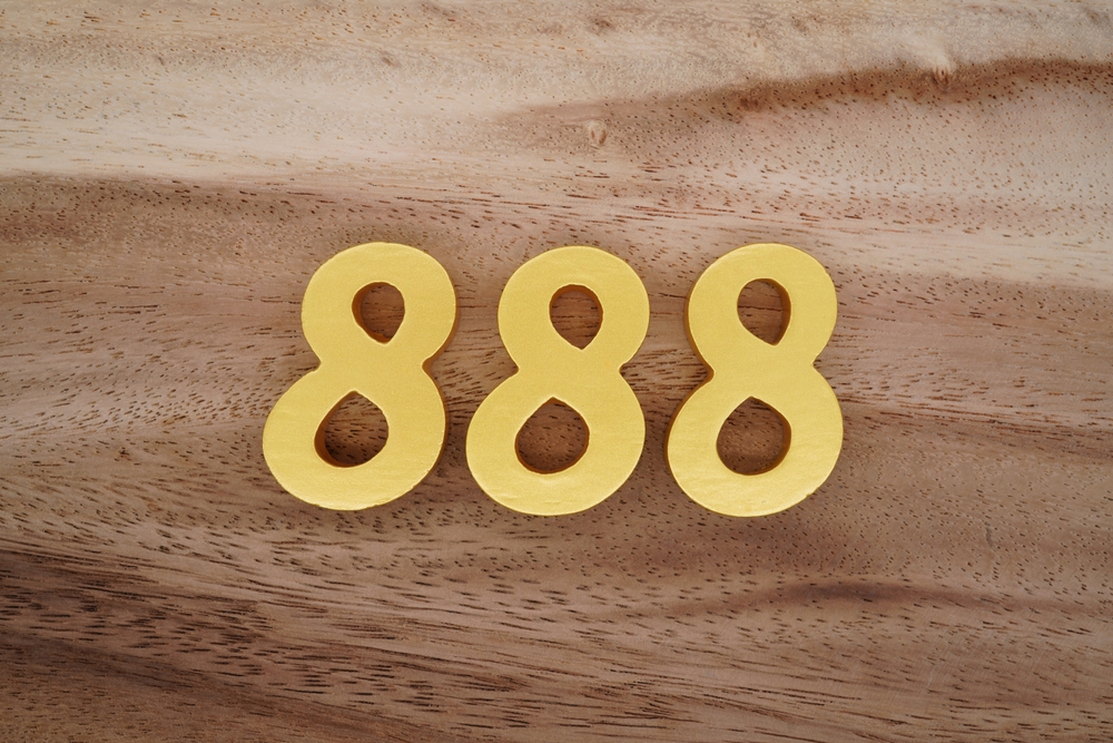 888 written on a wooden background