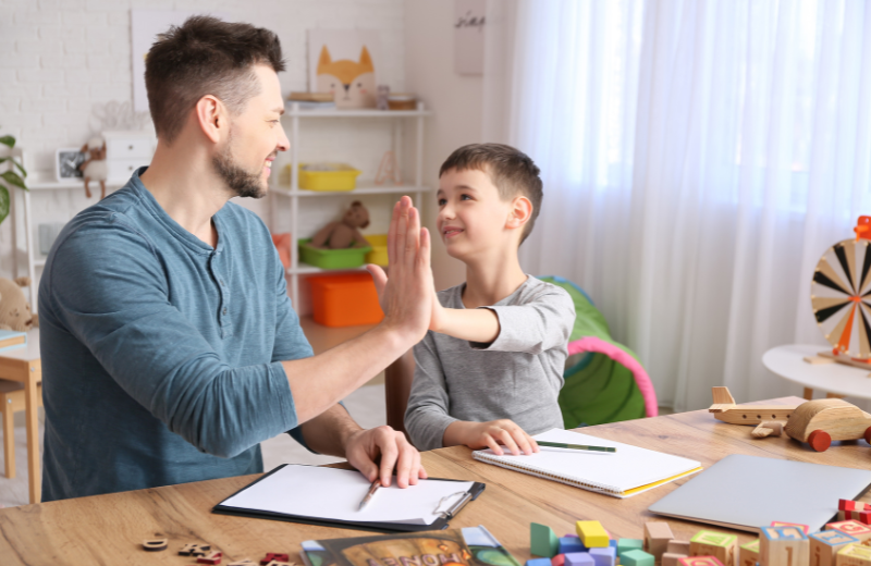 Teacher and autistic child