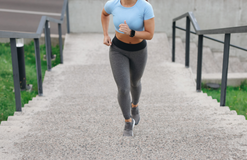 woman jogging up stairs