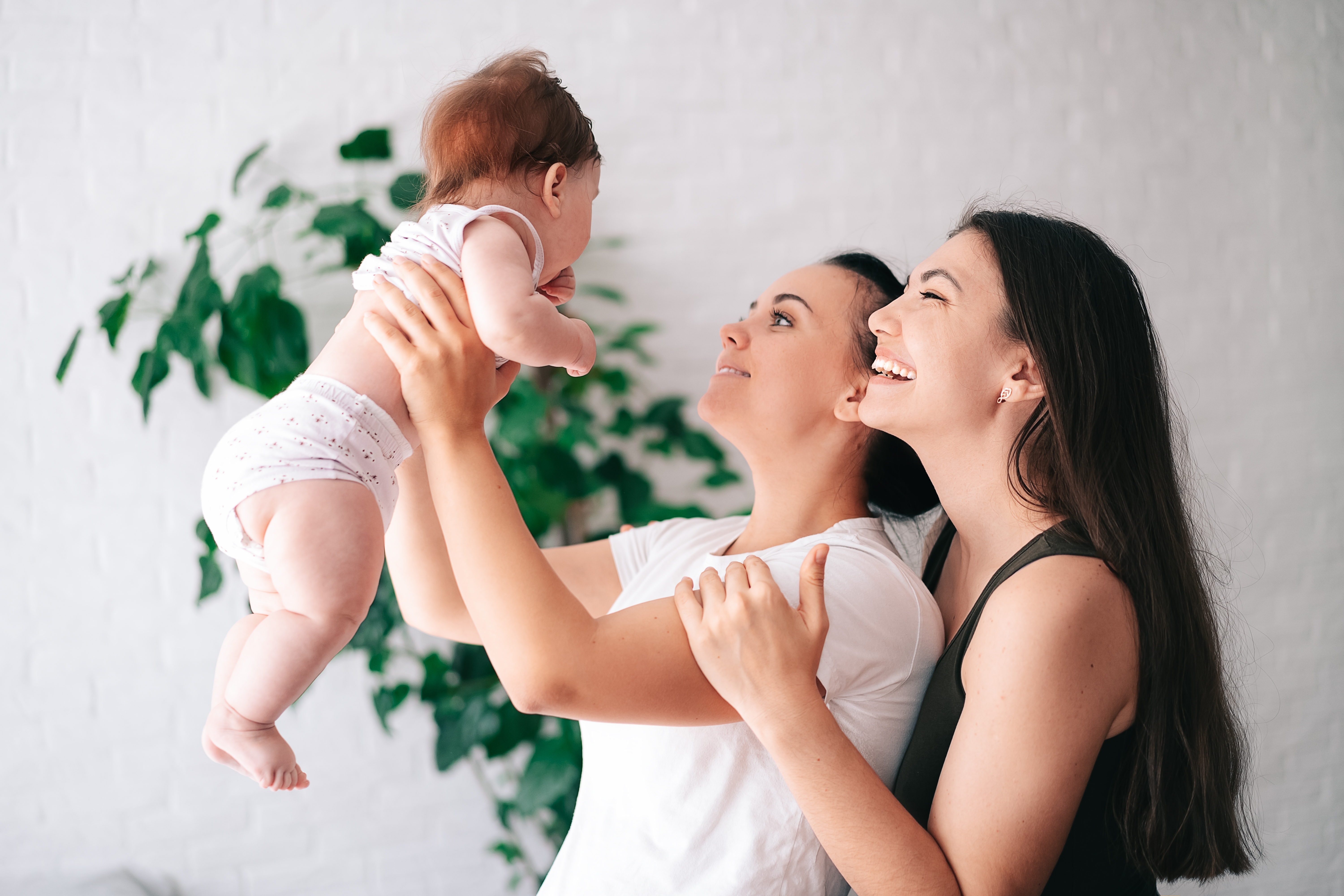 Two mothers with their baby, same sex relationship