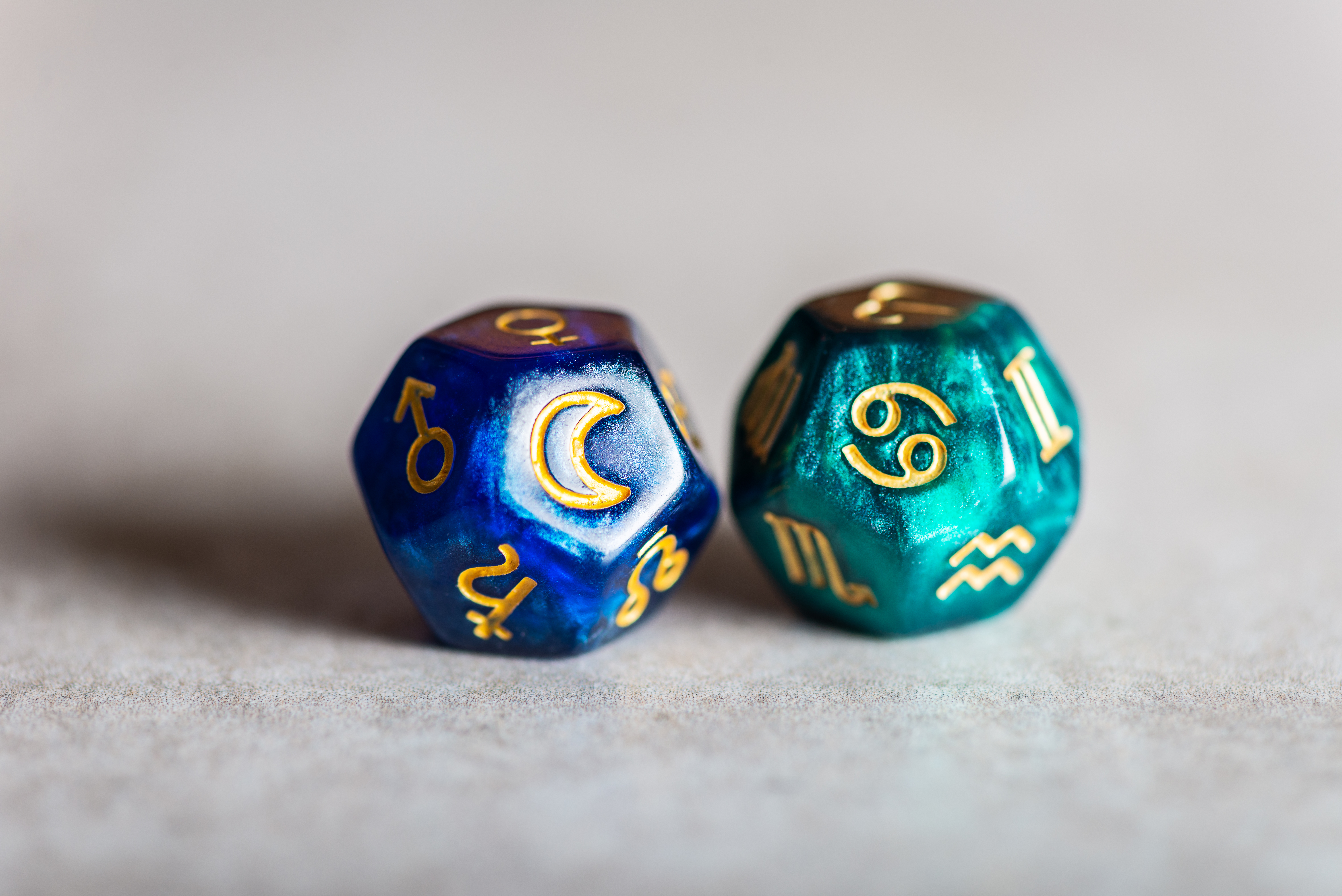 Astrology Dice with zodiac symbol of Cancer on one and a moon on the other