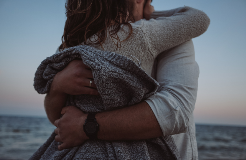 couple hugging on beach