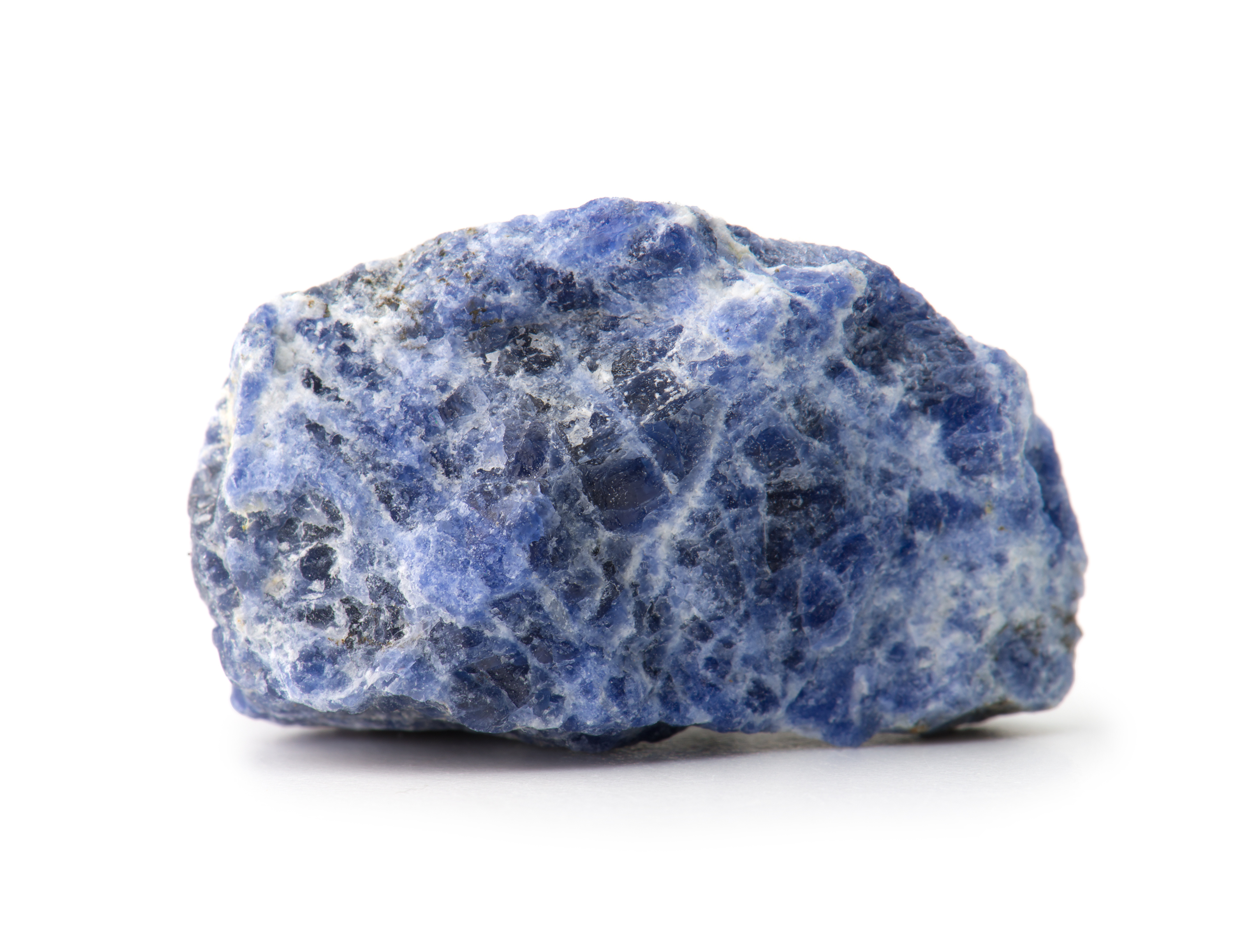 A piece of Sodalite rock on a white background