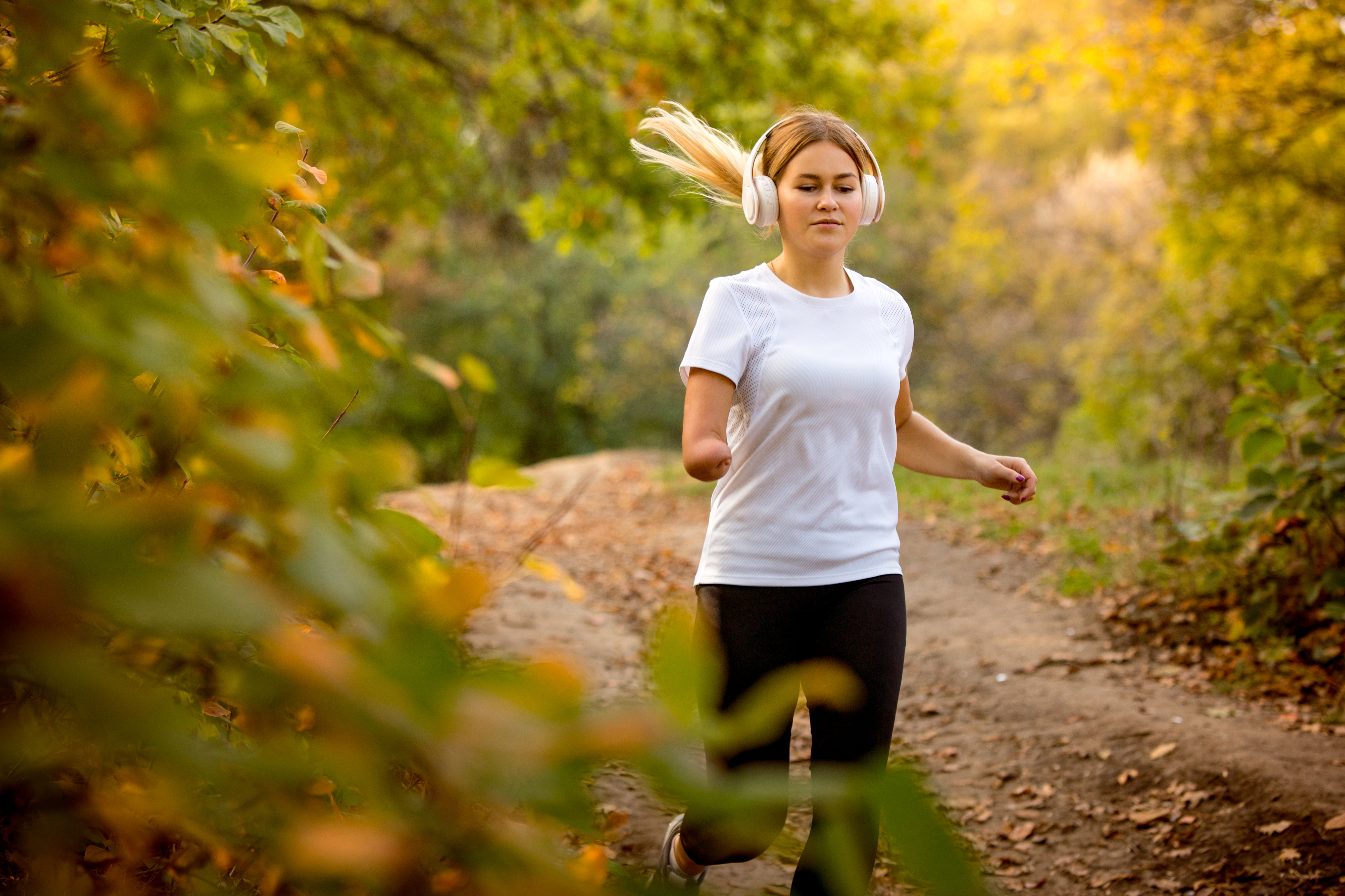 Disabled woman jogging, fitness outdoors