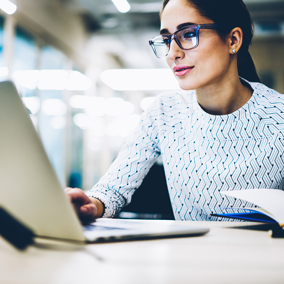 Secretary working at a laptop