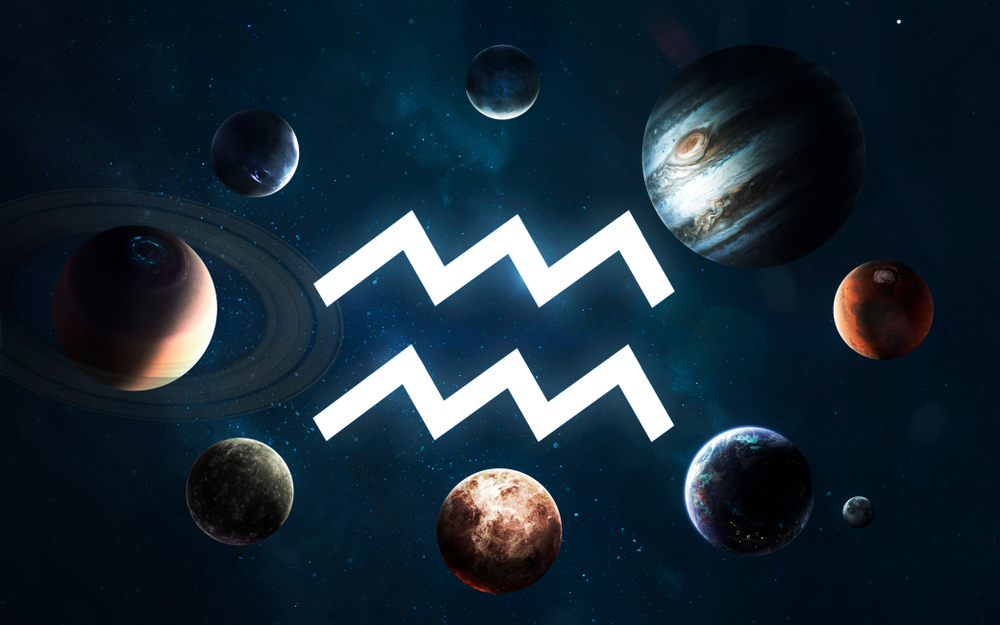 Aquarius star sign symbol surrounded by planets