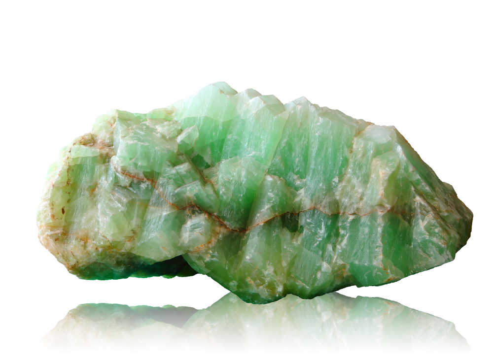 A piece of raw Jade on a white background