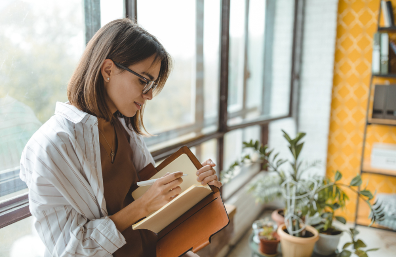 woman writing a book