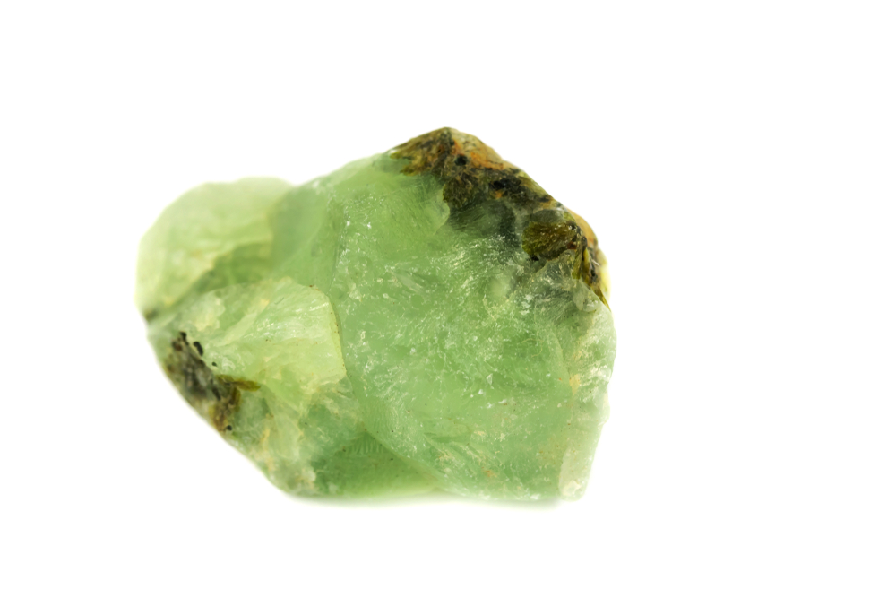 A piece of Prehnite on a white background