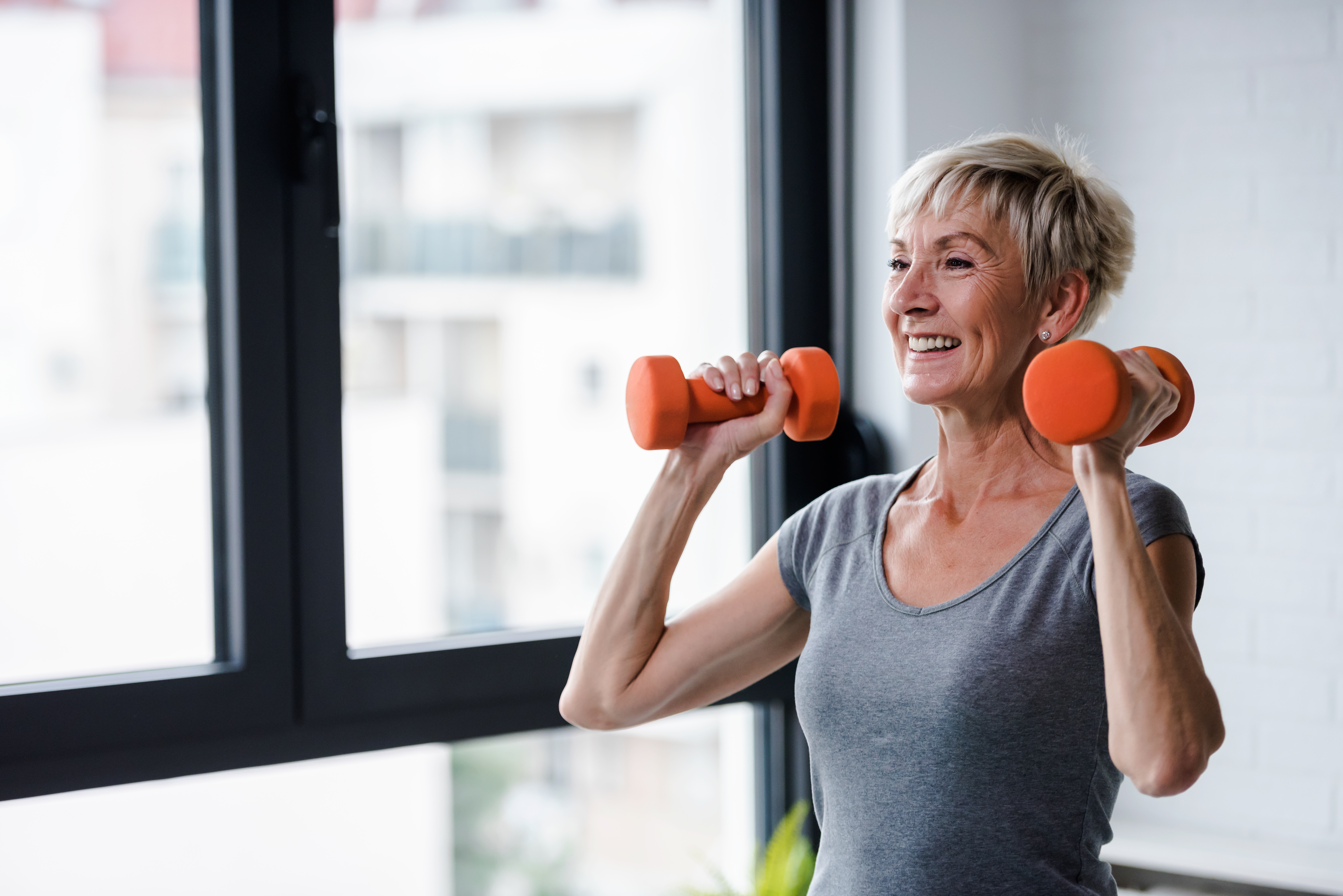 An older woman doing strength training