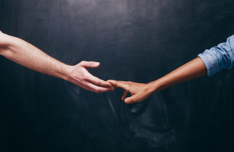 two hands letting go