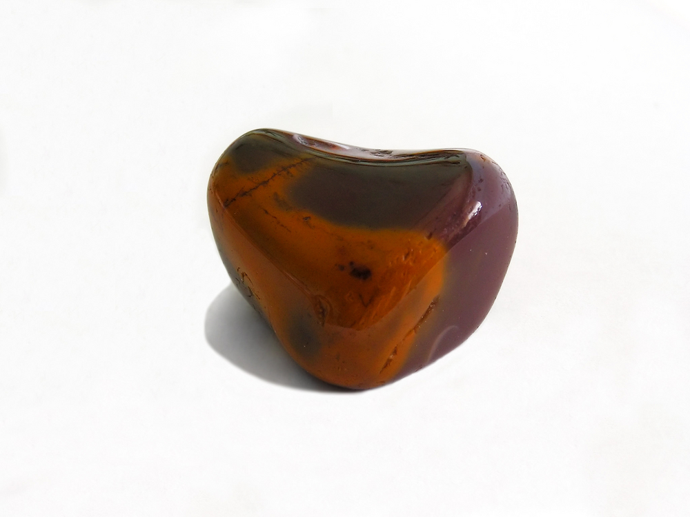 A piece of Mookaite on a white background