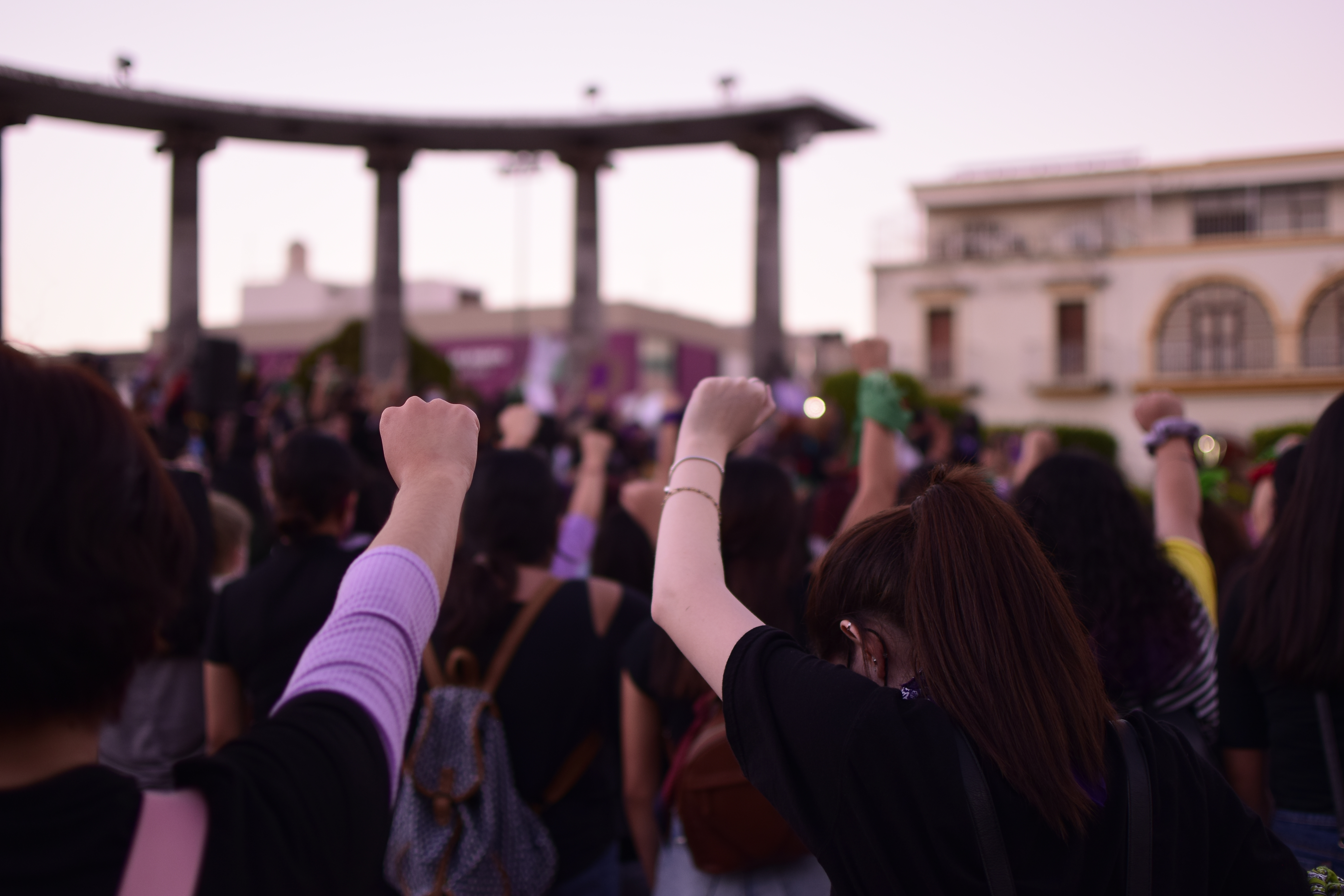 feminist march, empowered women with their fists raised