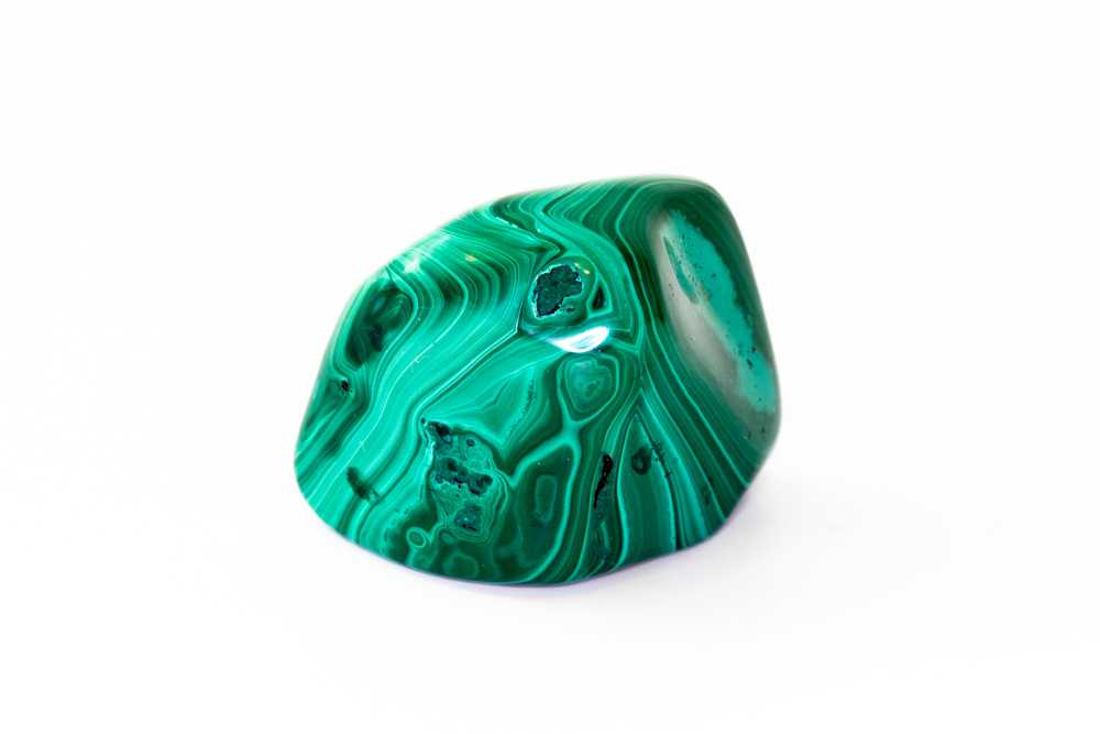 A piece of Malachite on a white background