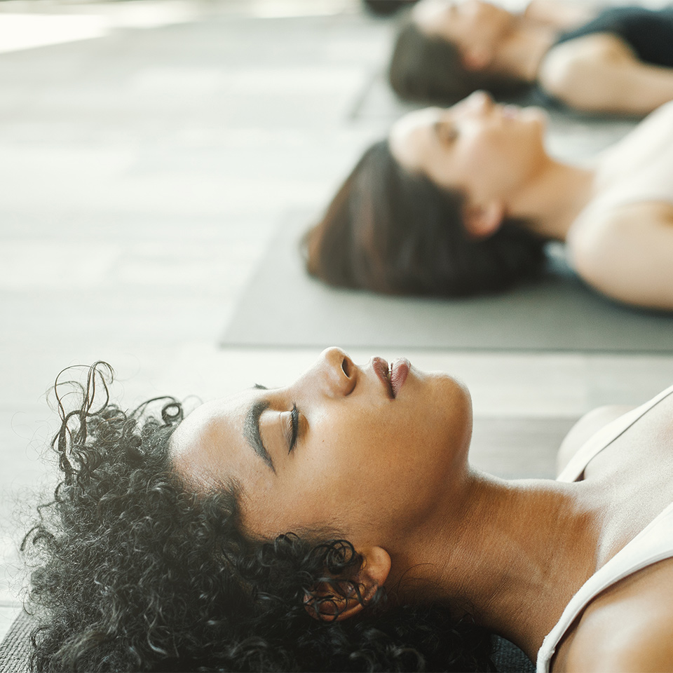 Person practicing Yoga Nidra in a studio