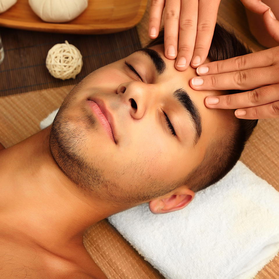 Man receiving an Indian head massage