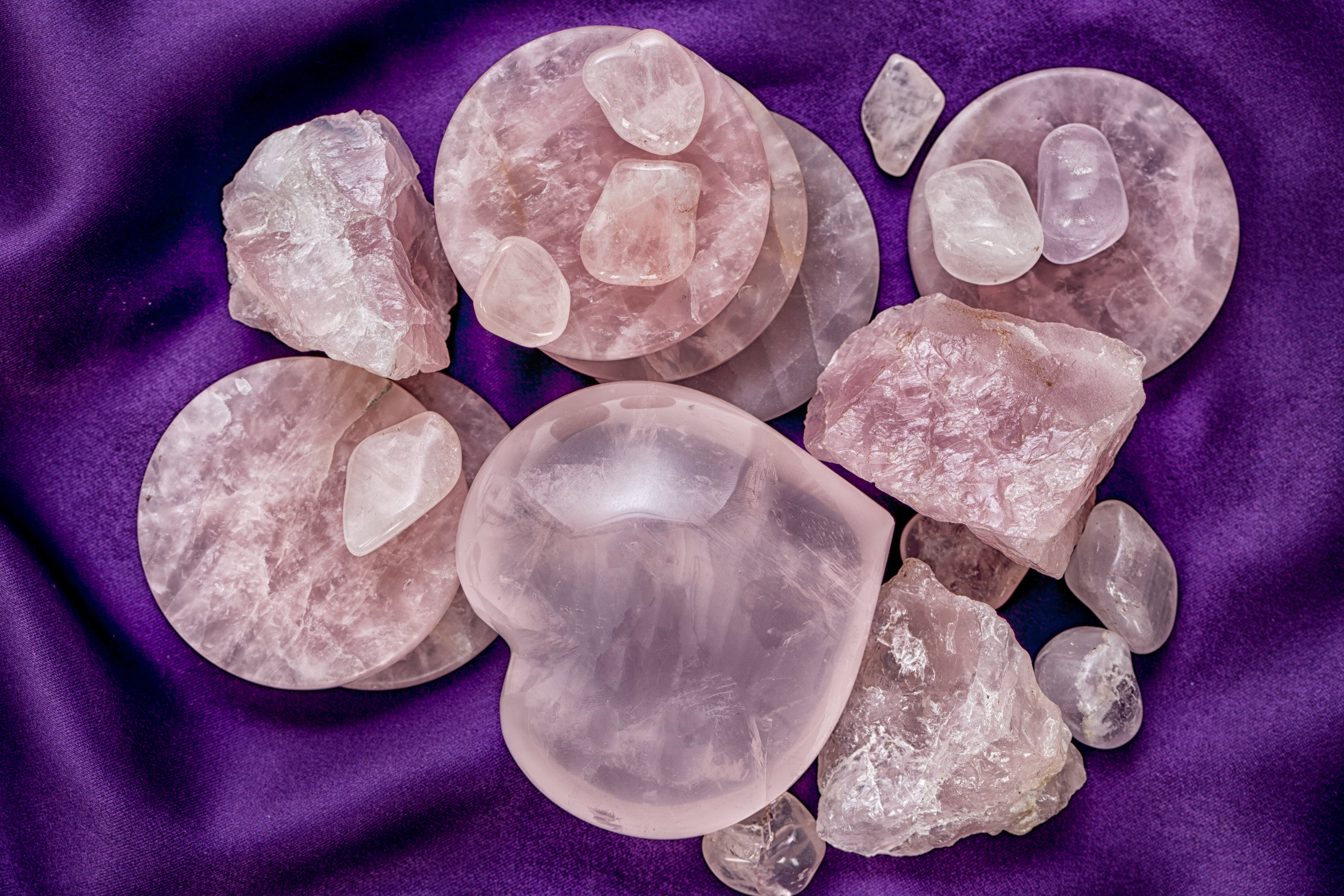 Lots of pieces of rose quartz in different shapes including a large love heart piece