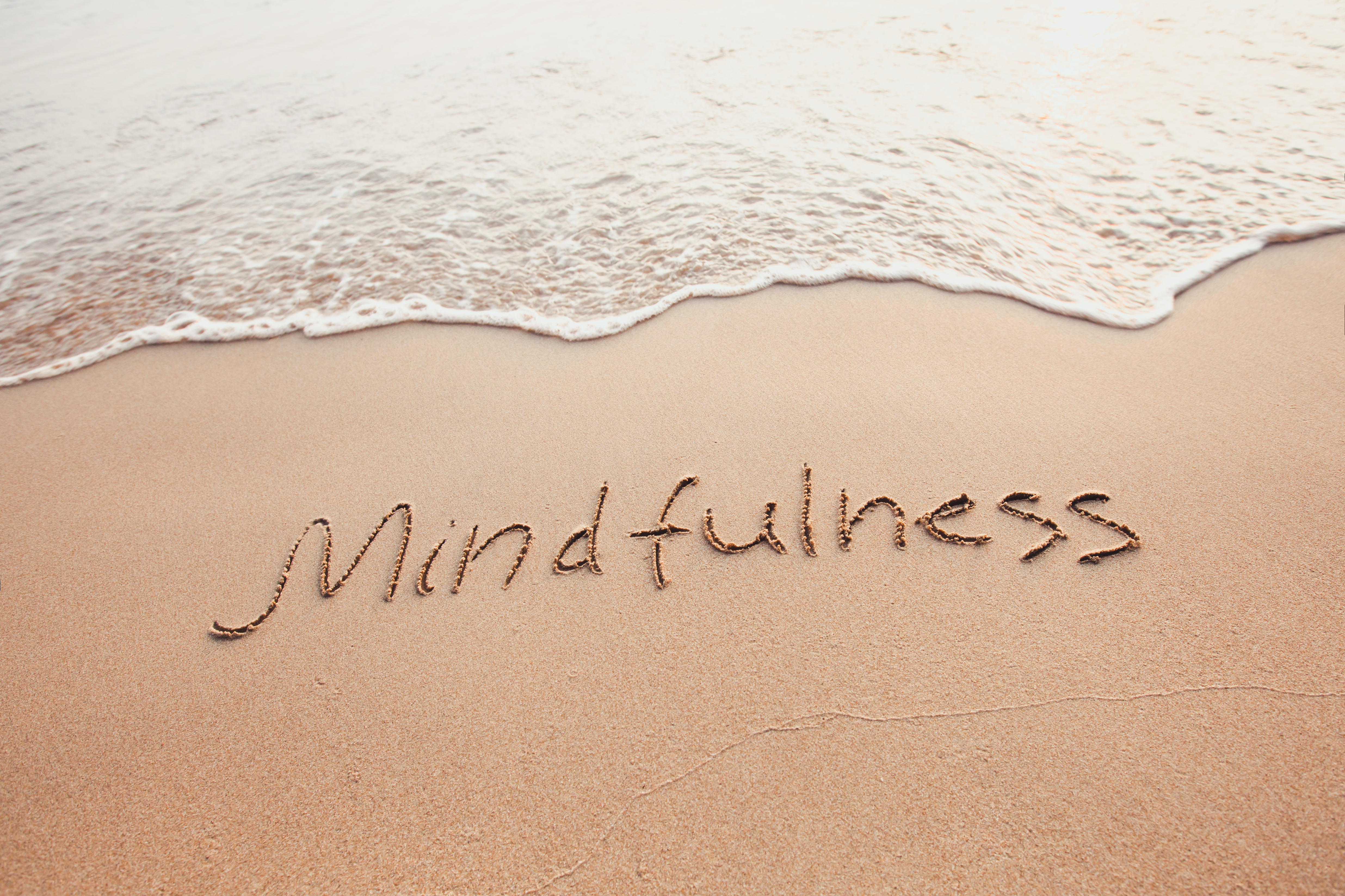Mindfulness written in the sand