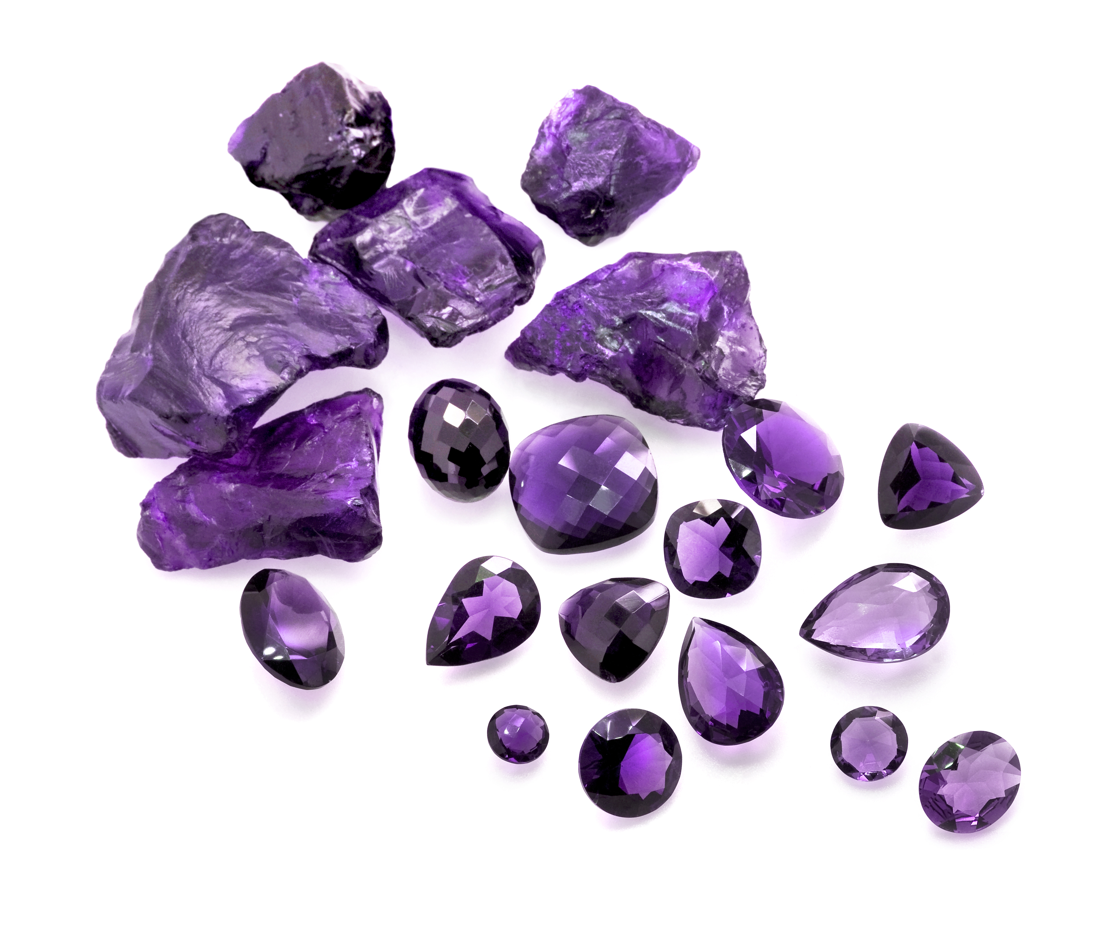 Pieces of polished and raw Amethyst on a white background
