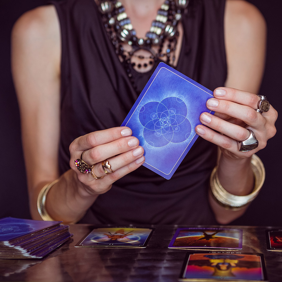 Fortune teller forecasting the future with oracle cards.