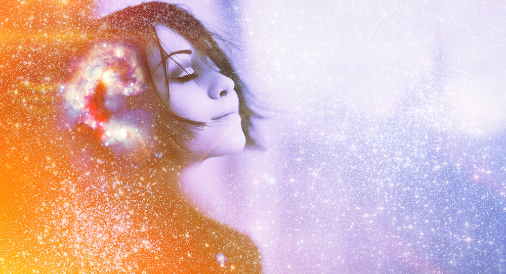 A smiling girl with her eyes closed and cosmic swirls and stars all around her